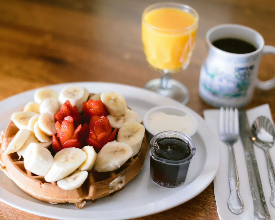 Menu item: breakfast waffle with fresh fruit.